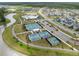 Aerial view of the community amenities featuring multiple sport courts, a pool, and a clubhouse at 219 Symphony Ave, Summerville, SC 29486