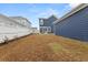Wide view of backyard with an outdoor dining set and white vinyl fencing at 219 Symphony Ave, Summerville, SC 29486