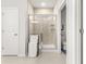 Bathroom featuring a glass enclosed shower, storage, and modern finishes at 219 Symphony Ave, Summerville, SC 29486