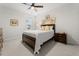 This bedroom features a cozy queen bed, carpeted floors, and a ceiling fan for added comfort at 219 Symphony Ave, Summerville, SC 29486