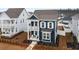 Charming two-story blue home with white trim, dual porches, and manicured landscaping at 219 Symphony Ave, Summerville, SC 29486