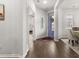Bright foyer with hardwood floors, stylish decor, and a charming welcome sign at 219 Symphony Ave, Summerville, SC 29486