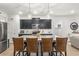 Bright kitchen boasts a granite island with seating and stainless steel appliances at 219 Symphony Ave, Summerville, SC 29486