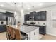 Open kitchen featuring a large island with seating, granite countertops, and stainless appliances at 219 Symphony Ave, Summerville, SC 29486