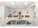 Close-up of kitchen island featuring granite countertop, stainless steel sink, and seating at 219 Symphony Ave, Summerville, SC 29486