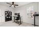 Office space with black desk setup, comfortable chair, and decor on shelves at 219 Symphony Ave, Summerville, SC 29486
