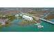 Panoramic aerial view of the condo building, waterfront, private boat dock, and scenic coastal landscape at 2395 Folly Road # 4H, Folly Beach, SC 29439