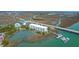 Expansive aerial view of the condo building, private boat dock, waterway and surrounding marshlands at 2395 Folly Road # 4H, Folly Beach, SC 29439