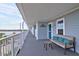 Spacious balcony with cozy seating and stunning views of the surrounding waterway at 2395 Folly Road # 4H, Folly Beach, SC 29439