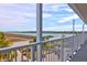 Large balcony offering scenic views of the water and lush greenery at 2395 Folly Road # 4H, Folly Beach, SC 29439