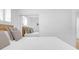Bright bedroom featuring a comfortable bed with a sliding mirror door closet at 2395 Folly Road # 4H, Folly Beach, SC 29439