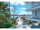 Charming outdoor space featuring multi-story balconies overlooking a scenic waterfront and pier at 2395 Folly Road # 4H, Folly Beach, SC 29439
