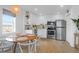 An eat-in kitchen featuring stainless steel appliances, and a dining table with seating at 2395 Folly Road # 4H, Folly Beach, SC 29439
