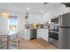 Eat-in kitchen featuring modern appliances and finishes, ample counter space, and natural light at 2395 Folly Road # 4H, Folly Beach, SC 29439