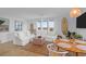 A bright and airy living room with a coastal modern design and plenty of natural light at 2395 Folly Road # 4H, Folly Beach, SC 29439