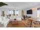 Open-concept living room featuring a spacious seating area and a large window for natural light at 2395 Folly Road # 4H, Folly Beach, SC 29439