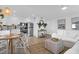 Inviting open-concept living space with a stylish dining area and a cozy seating arrangement at 2395 Folly Road # 4H, Folly Beach, SC 29439