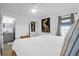 Comfortable main bedroom featuring closet, en-suite bathroom and natural light at 2395 Folly Road # 4H, Folly Beach, SC 29439