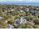 Bird's-eye view of a stunning coastal property with a pool, nestled among trees near the serene ocean waters at 27 22Nd Ave, Isle of Palms, SC 29451