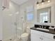 Bathroom featuring a glass enclosed shower, dark countertop, and white cabinets at 27 22Nd Ave, Isle of Palms, SC 29451