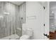 Bathroom featuring a tiled glass shower and a door leading to a bunk bedroom at 27 22Nd Ave, Isle of Palms, SC 29451