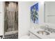 Bathroom features a marble countertop, and a glass enclosed shower with decorative tiles at 27 22Nd Ave, Isle of Palms, SC 29451