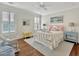Bedroom with shuttered windows, wood floors, and vibrant decor at 27 22Nd Ave, Isle of Palms, SC 29451