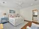 Cozy bedroom features colorful decor, hardwood floors, and bright natural light at 27 22Nd Ave, Isle of Palms, SC 29451