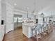 Spacious all-white kitchen with large island, stainless steel appliances, and ample seating at 27 22Nd Ave, Isle of Palms, SC 29451