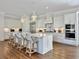 Gourmet kitchen featuring a large center island, stainless steel appliances, and custom cabinetry at 27 22Nd Ave, Isle of Palms, SC 29451