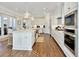 Well-lit kitchen with stainless appliances, center island, and ample cabinet space at 27 22Nd Ave, Isle of Palms, SC 29451