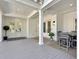 Inviting covered patio with dining and seating areas, perfect for outdoor entertaining and relaxation at 27 22Nd Ave, Isle of Palms, SC 29451