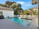 Backyard pool with poolside seating offering a relaxing outdoor space and sunny skies at 27 22Nd Ave, Isle of Palms, SC 29451
