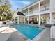 Stunning home featuring a refreshing pool and spacious outdoor patio, perfect for entertaining and relaxation at 27 22Nd Ave, Isle of Palms, SC 29451