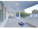 Spacious porch with ceiling fans and yard games at 27 22Nd Ave, Isle of Palms, SC 29451