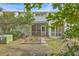 Exterior view of back of home with screened porches and landscaping at 2765 Jobee Dr # 1304, Charleston, SC 29414