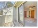 View from a wooden balcony into a carpeted bedroom at 2765 Jobee Dr # 1304, Charleston, SC 29414