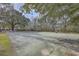 Outdoor basketball court surrounded by mature trees at 2765 Jobee Dr # 1304, Charleston, SC 29414