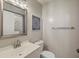 Well-lit bathroom featuring a vanity sink, toilet, large mirror, and decorative wall art at 2765 Jobee Dr # 1304, Charleston, SC 29414