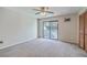 Spacious bedroom with sliding glass doors, neutral carpet, ceiling fan, and closet at 2765 Jobee Dr # 1304, Charleston, SC 29414