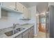 Well-lit kitchen featuring granite countertops, stainless steel refrigerator, and plentiful cabinet space at 2765 Jobee Dr # 1304, Charleston, SC 29414
