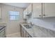 Updated kitchen featuring granite countertops, stainless steel sink, modern appliances, and bright window at 2765 Jobee Dr # 1304, Charleston, SC 29414