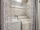 Functional laundry area equipped with a washer, dryer, and wire shelving for storage at 2765 Jobee Dr # 1304, Charleston, SC 29414