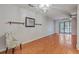 Spacious living room features hardwood floors, a ceiling fan, and access to the outdoor space at 2765 Jobee Dr # 1304, Charleston, SC 29414