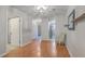 Open-concept living room features hardwood floors, ceiling fan, bright lighting, and neutral walls at 2765 Jobee Dr # 1304, Charleston, SC 29414