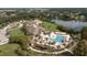 Community clubhouse and pool, surrounded by lush landscape, showcase luxury living near a scenic lake at 2784 Hidden Oak Dr, Seabrook Island, SC 29455
