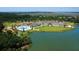 Aerial shot of the community with a pool, clubhouse, lake, and verdant green spaces at 2784 Hidden Oak Dr, Seabrook Island, SC 29455