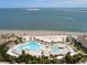 Aerial view of pools, beach, palm trees, and ocean in a beautiful community at 2784 Hidden Oak Dr, Seabrook Island, SC 29455