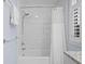 Tiled bathroom with shower-tub, features bright natural lighting, and modern chrome fixtures at 2784 Hidden Oak Dr, Seabrook Island, SC 29455