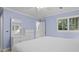 A charming bedroom in soft blue with a king bed, white dresser, and ensuite bathroom access at 2784 Hidden Oak Dr, Seabrook Island, SC 29455